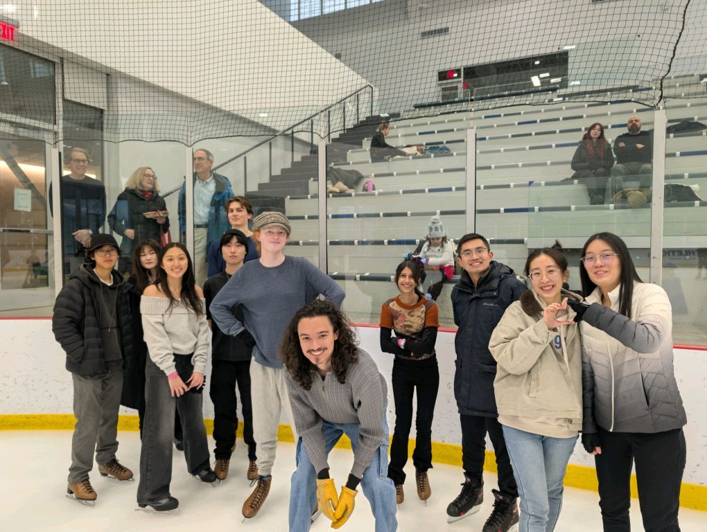 Club members on the ice at a skating social